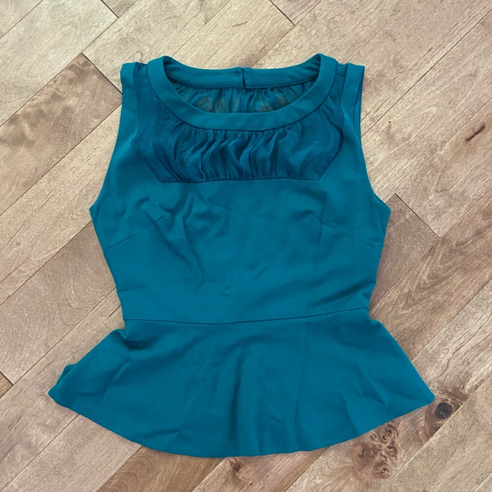 Green Bebe top with sheer cut outs